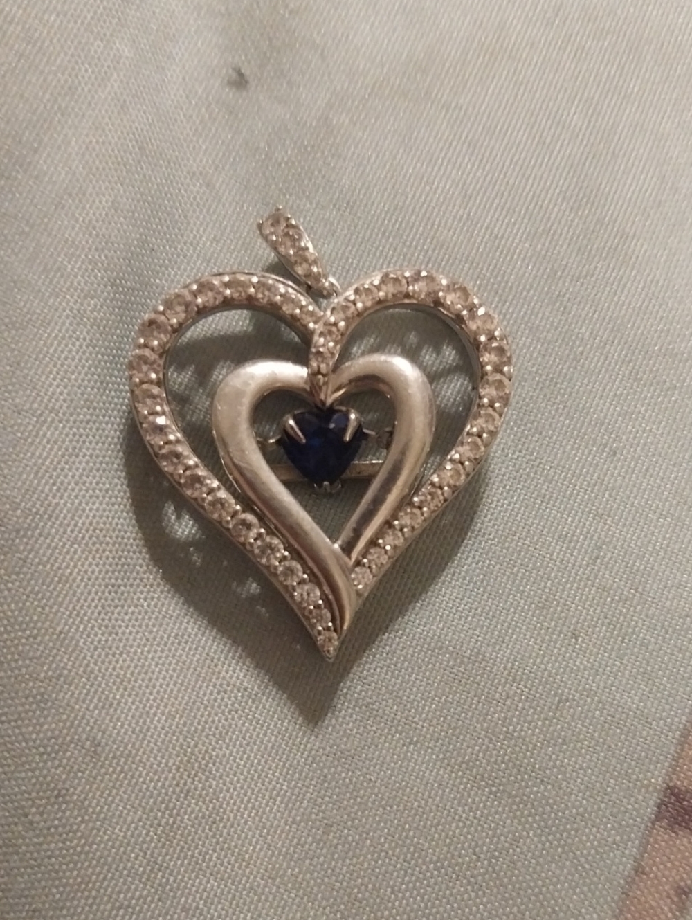 Silver Heart Pendant with Blue Heart-Cut Stone That Steadily Moves